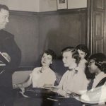 friar teaching a class of students