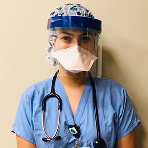 female nurse with full protective gear
