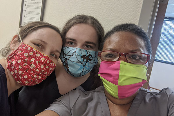 three female nurses with masks