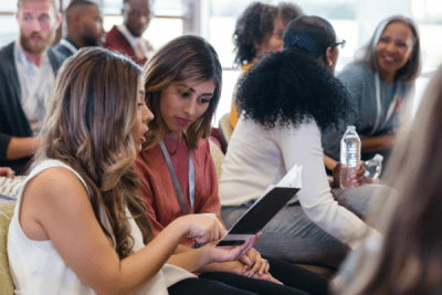 men and women talking while learning about education