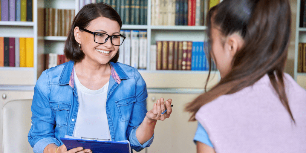 usf school social worker speaking with young student